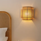 Soft yellow glow from the ORLUNE HOME wall light creates a warm, modern ambiance.