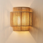 Warm, soft glow from woven rattan shade creates unique striped shadows on your wall.