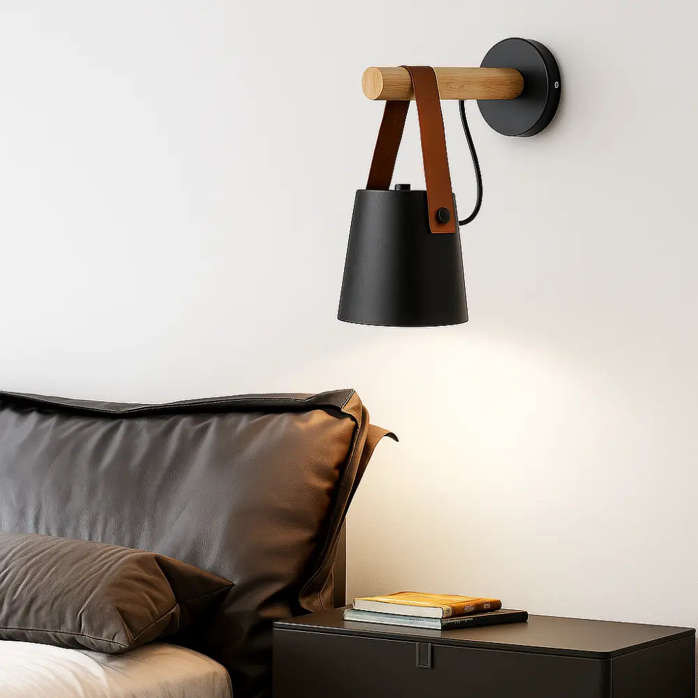 Experience warm, modern lighting with this Scandinavian wood wall sconce and sleek black shade.