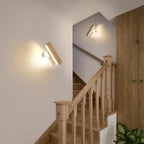 ORLUNE HOME’s Rotating Nordic Style Wooden LED Wall Light gently brightens the stairway.