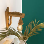 Effortlessly brighten your space with the rustic charm of this wooden wall light.
