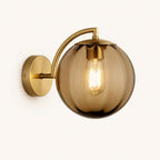 Illuminate your space with retro charm—brass base, ribbed globe, and glowing filament bulb.