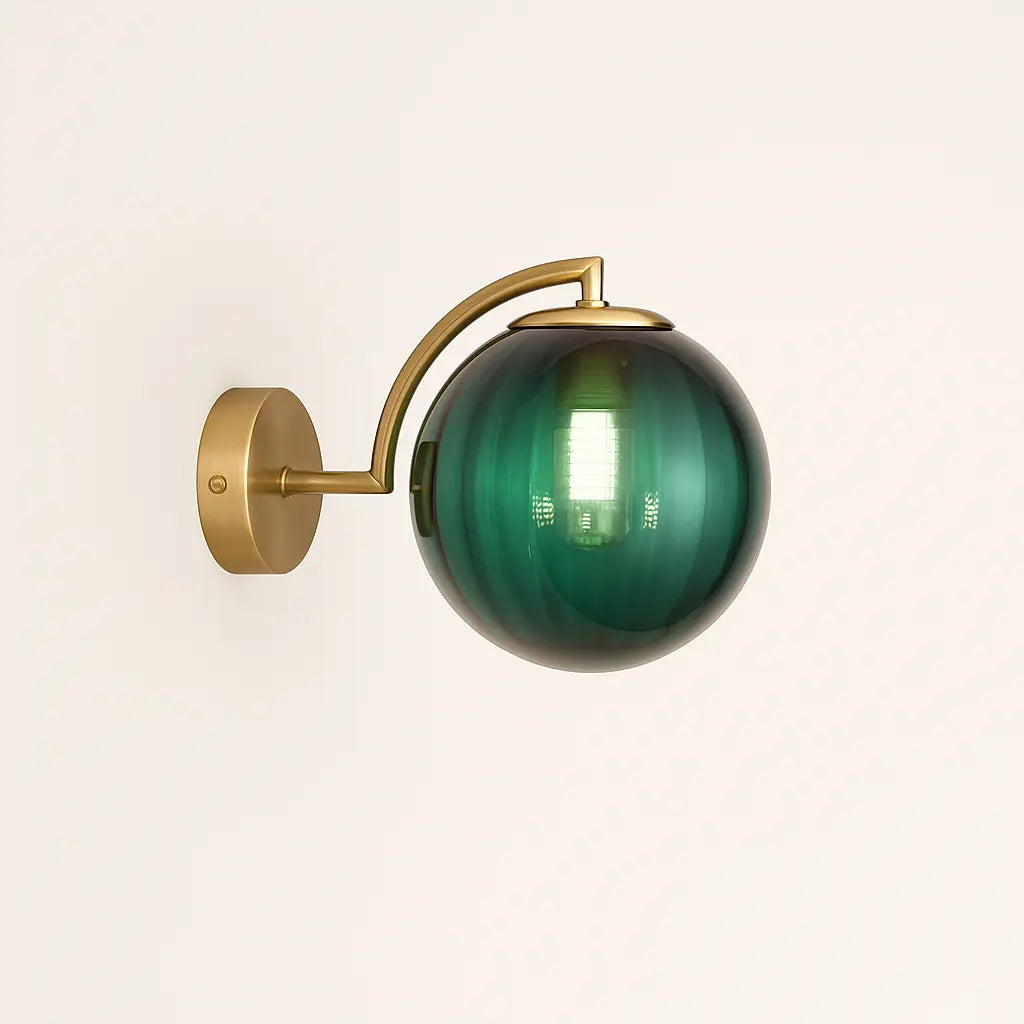 This brass wall light casts a warm, elegant glow through its ribbed glass globe.