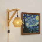 Warm, retro wooden wall light with braided shade and exposed cord brings cozy illumination.
