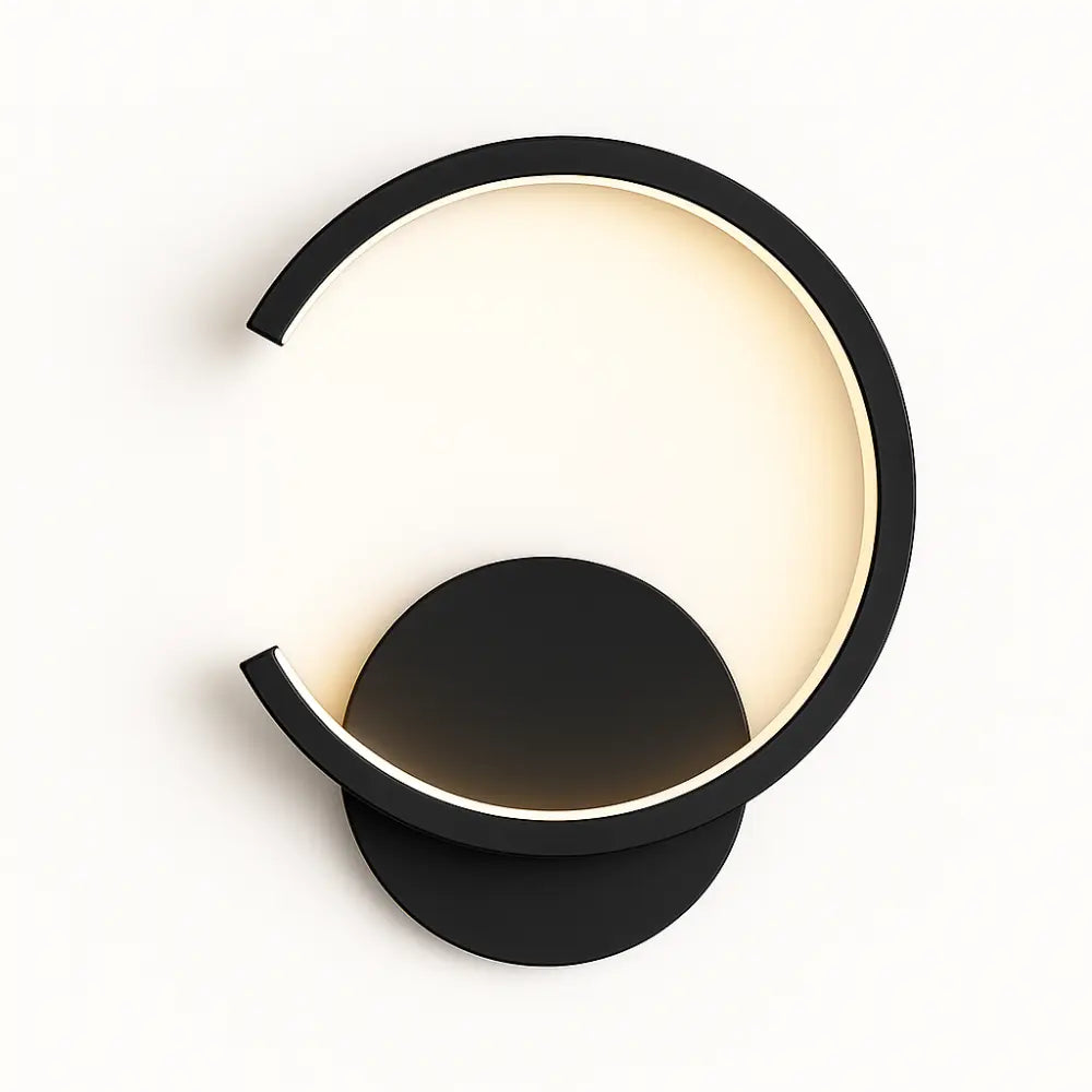 Modern black half-circle LED wall light with open circular ring, softly glowing.