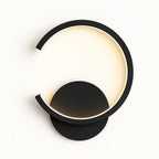 Modern black half-circle LED wall light with open circular ring, softly glowing.
