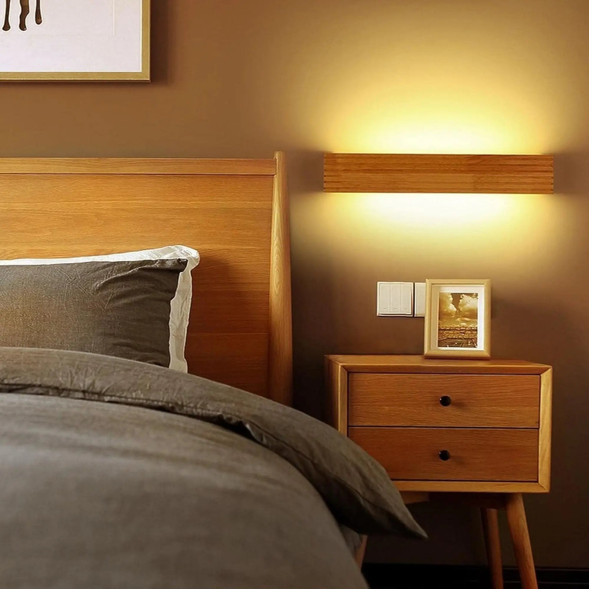 The ORLUNE HOME LED Wall Light casts a gentle, soothing glow on the brown wall.