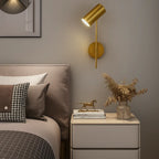 The LED gold wall sconce offers chic, adjustable lighting perfect for bedside reading.
