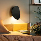 Modern Aluminum Round LED Wall Sconce casts warm light, featuring sleek aluminum and minimalist design.