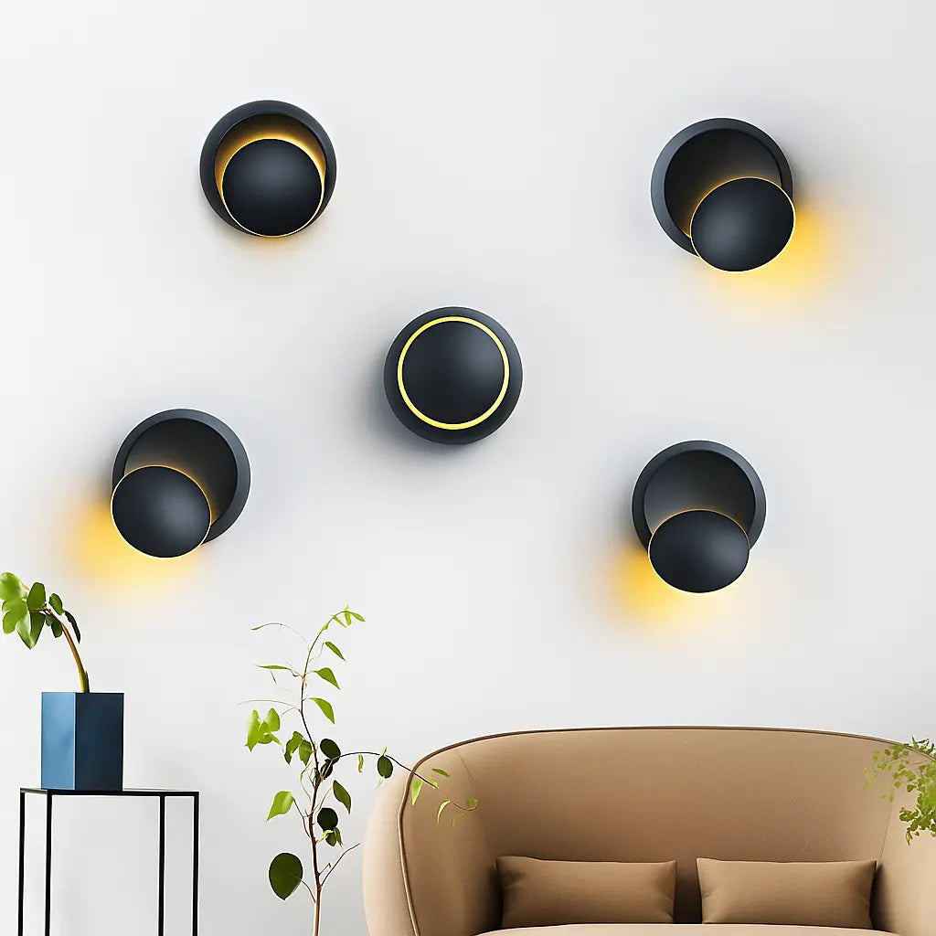 Five ORLUNE HOME LED sconces cast soft yellow light in a striking artistic pattern.