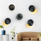 Five ORLUNE HOME LED sconces cast soft yellow light in a striking artistic pattern.