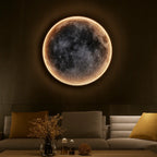 A round LED moon wall light with adjustable intensity, casting a luminous glow.