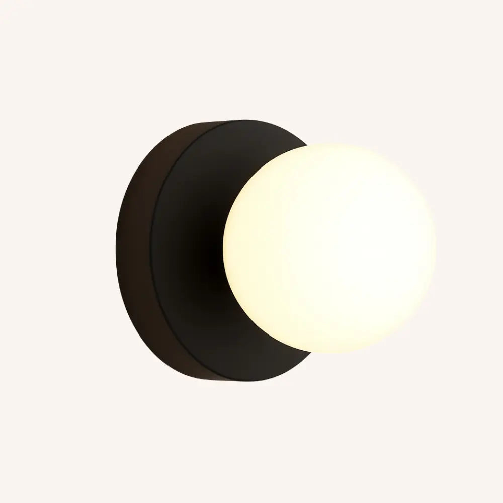 Illuminate your home with a soft, modern glow from this opal glass wall lamp.