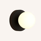 Illuminate your home with a soft, modern glow from this opal glass wall lamp.