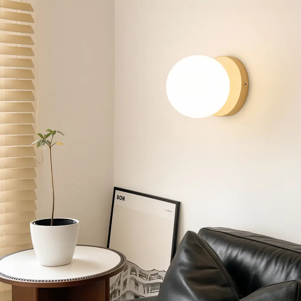 The ORLUNE HOME Scandinavian Round Opal Glass Wall Lamp LED creates soft, inviting illumination.