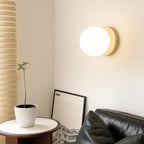 The ORLUNE HOME Scandinavian Round Opal Glass Wall Lamp LED creates soft, inviting illumination.