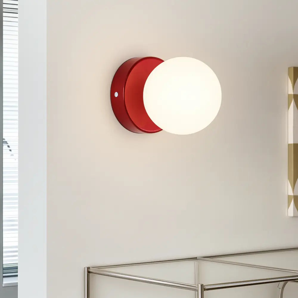 Enjoy soft, ambient illumination from the ORLUNE HOME opal glass wall lamp’s gentle LED glow.