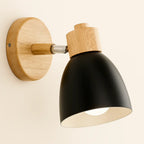 Warm, focused illumination with matte black shade and wooden accents enhances any wall’s glow.