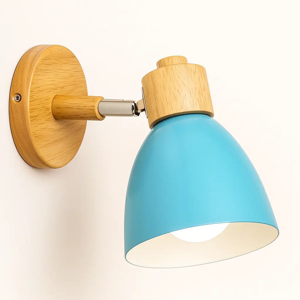 Vibrant blue cone shade and wood arm give modern, colorful illumination to pale walls.