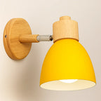 Experience a cozy, warm glow from the bright yellow shade and wooden base wall light.
