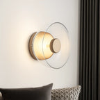 The ORLUNE HOME Wall Light bathes the room with warm, diffused LED illumination.