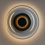 Warm, soft LED glow radiates in concentric rings, creating an elegant halo effect.