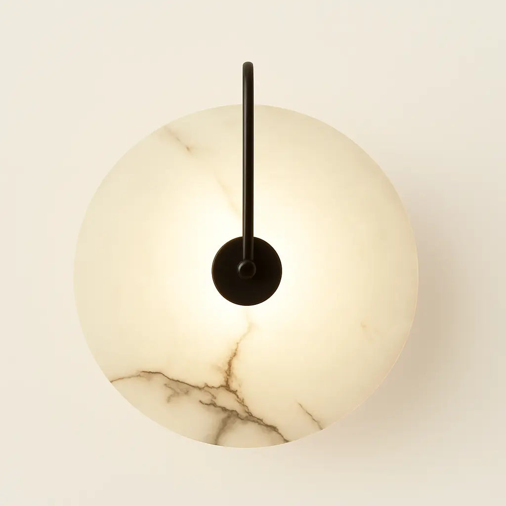 Minimalist circular LED wall lamp with marble-textured glowing shade and central black rod.