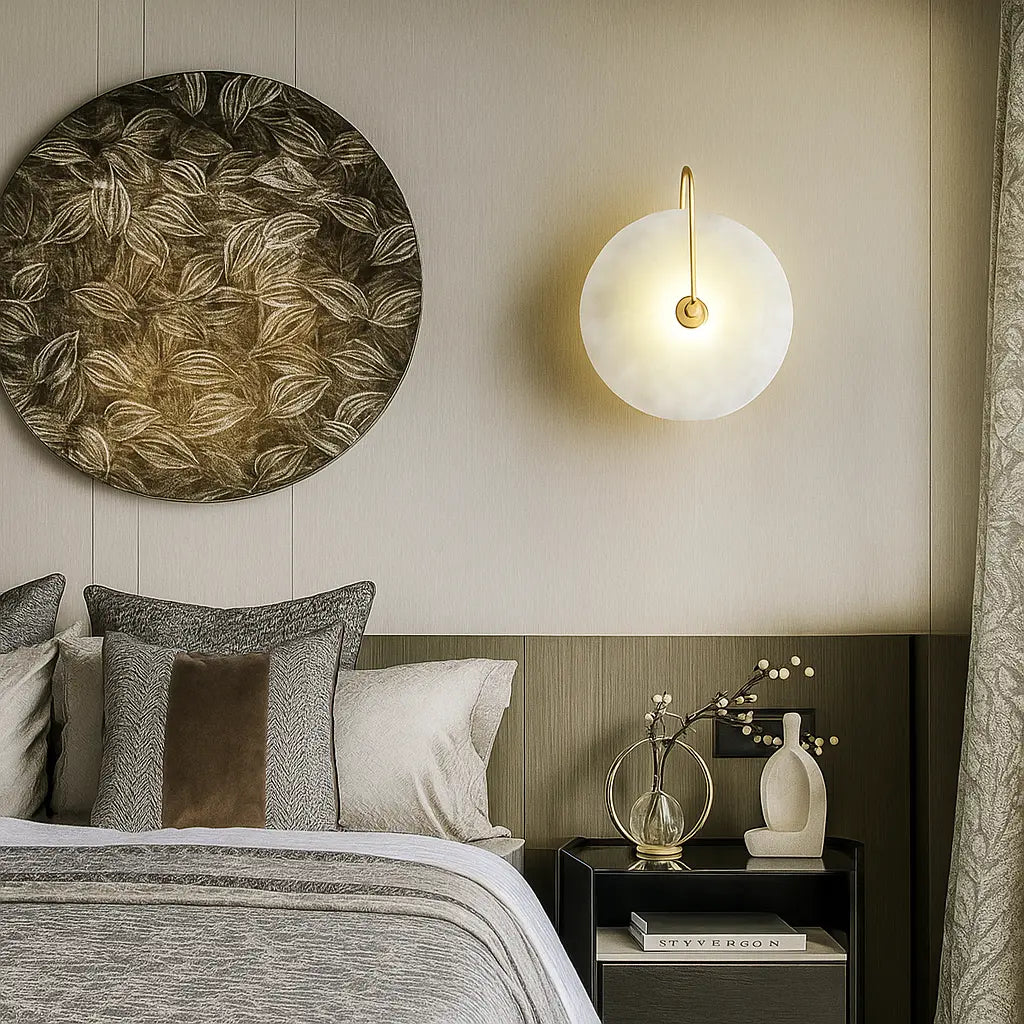A circular LED wall lamp with a minimalist design, glowing softly against a neutral wall.