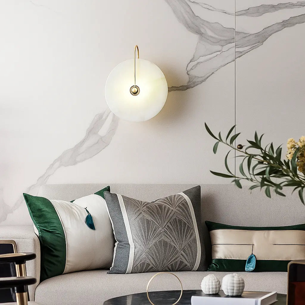 Circular LED wall lamp with a minimalist design, mounted on the wall, glowing softly.