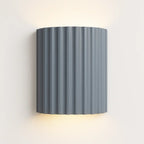 This wall light emits soft, indirect LED lighting upward and downward for a subtle glow.