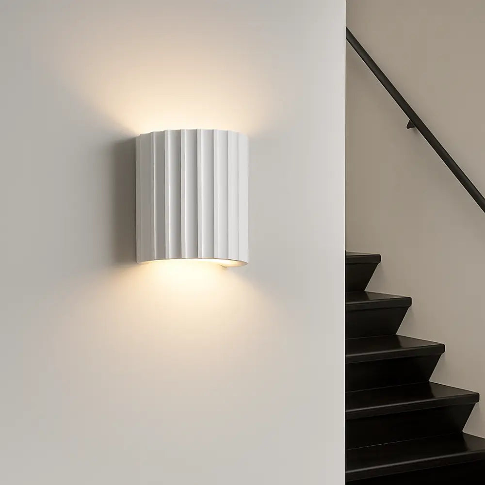 Soft, warm LED light glows upward and downward for elegant, modern ambient illumination.