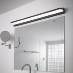 A sleek Contemporary LED Bathroom Wall Light in metal and acrylic, glowing above the mirror.