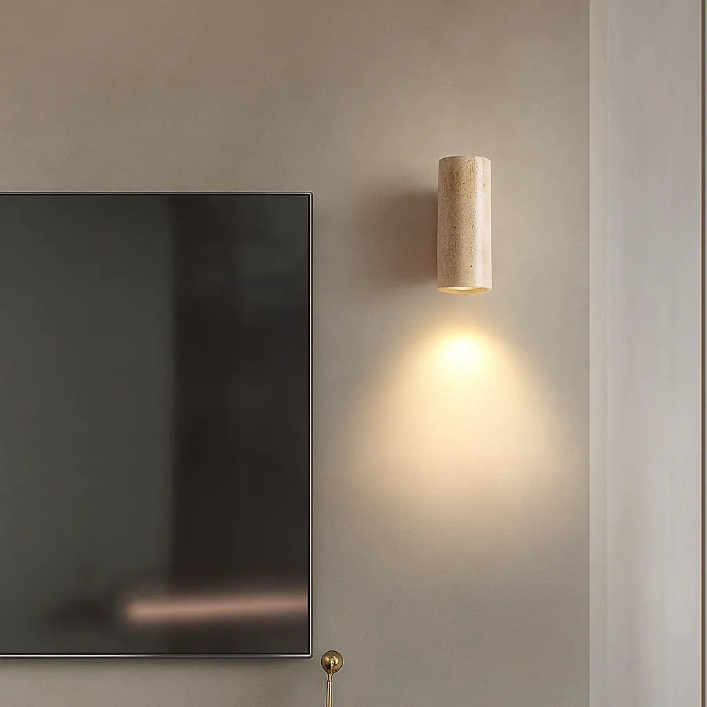 Warm, minimalist lighting glows from the round LED wall light for a serene ambiance.