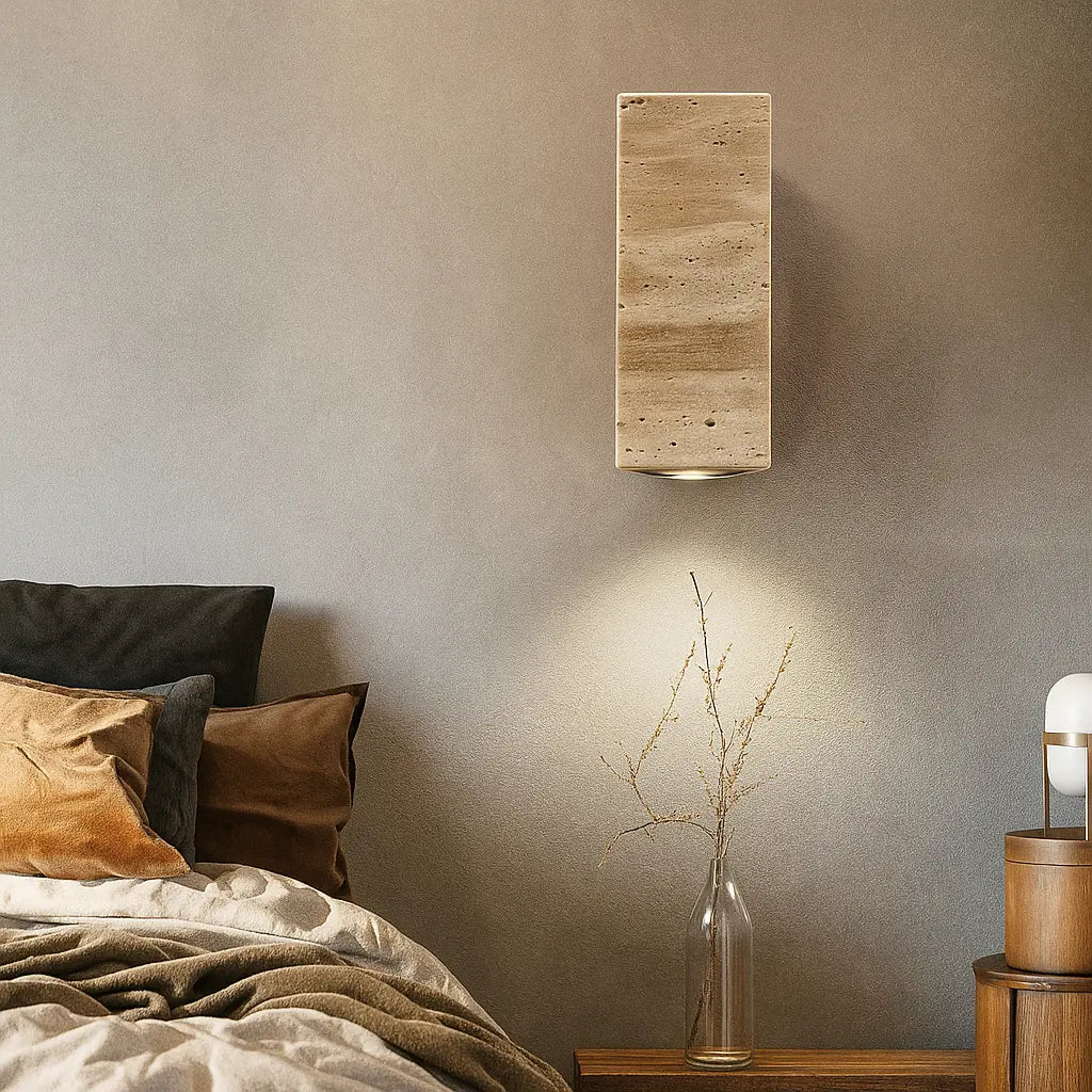 The ORLUNE HOME wall light casts a gentle, ambient glow with its natural travertine LED.
