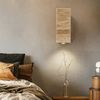 The ORLUNE HOME wall light casts a gentle, ambient glow with its natural travertine LED.