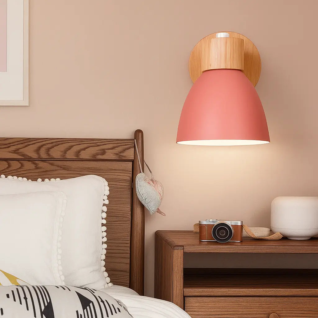 Soft Nordic wall light with a pink shade adds cozy, modern illumination to the room.
