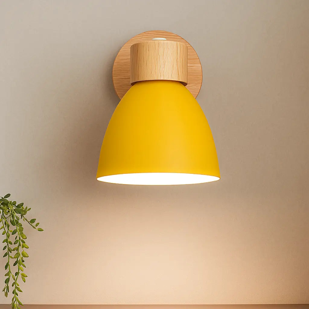 Soft, warm downward light shines from a round base and vibrant yellow dome shade.