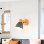 The Nordic wall light’s colorful shade brightens the room with cheerful, natural illumination.