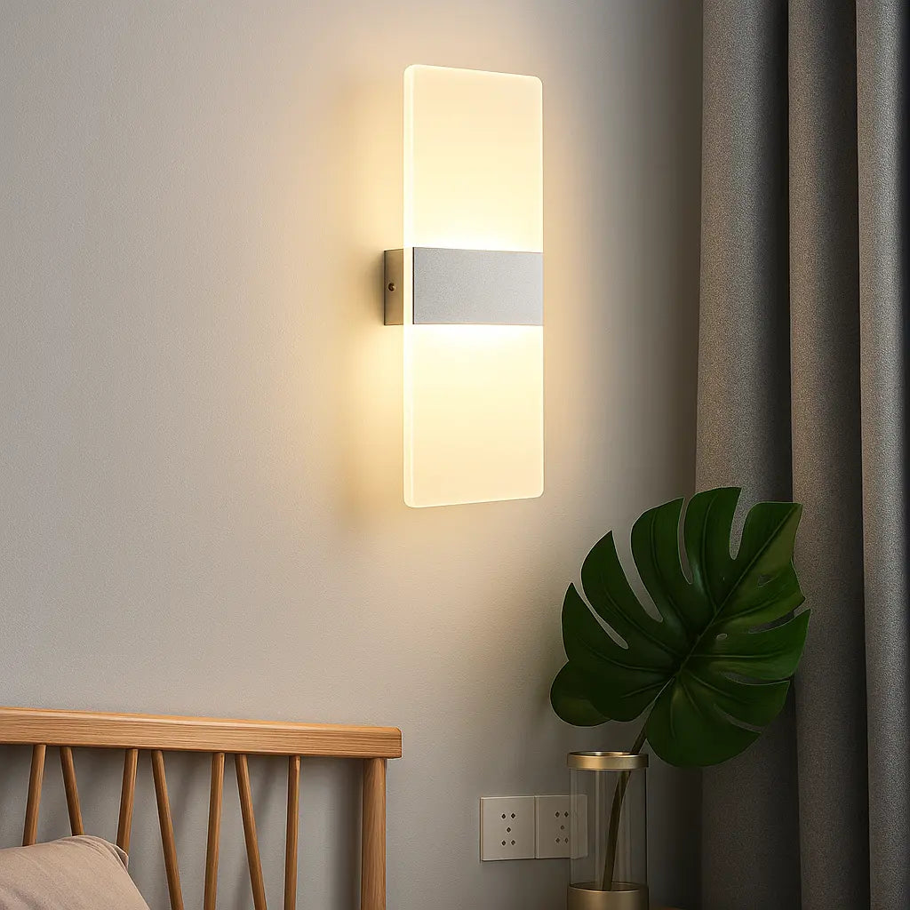 Rectangular LED Wall Sconce Brushed Metal Acrylic emits warm light against the wall.