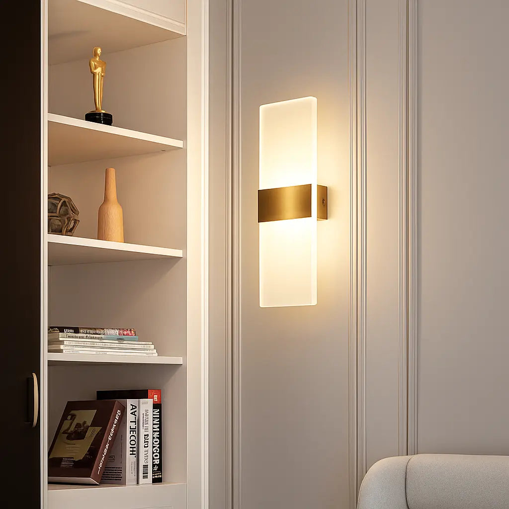 Rectangular brushed metal acrylic LED wall sconce with frosted glass shade, illuminated.