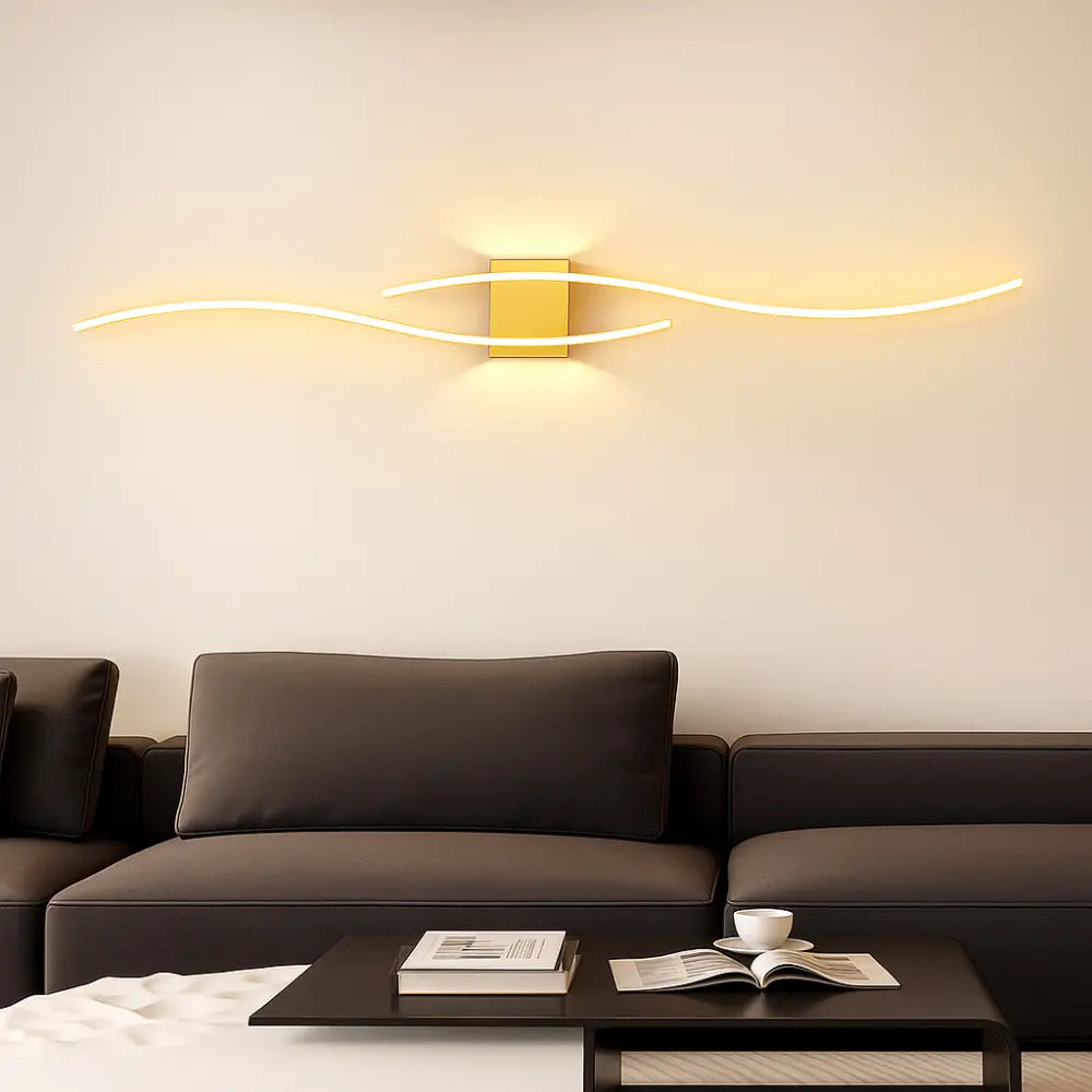 The ORLUNE HOME Modern LED Wave Wall Light casts a warm, inviting glow above.