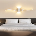 Sleek LED wave wall light with dual glowing strips creates modern, ambient illumination.
