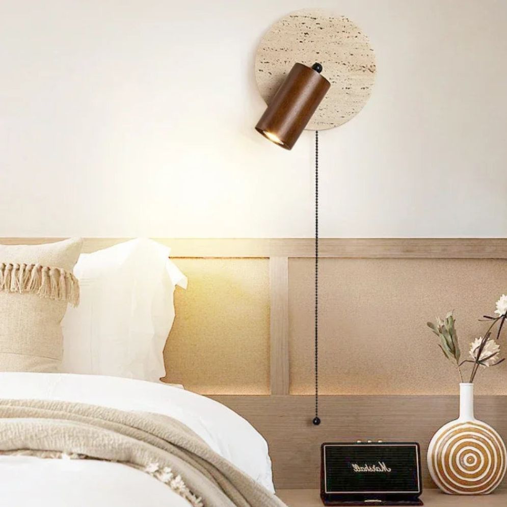 A rounded marble LED wooden wall light shines stylishly, blending soft curves and modern elegance.