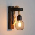 A square wood LED wall lamp with thick rope, metal mesh cage, and dark base.