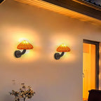 ORLUNE HOME wall lights cast a welcoming glow at dusk, illuminating the entryway.