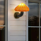 This rattan wall light offers a cozy, warm glow—perfect for enhancing any evening ambiance.