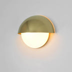 This half-moon LED wall light casts warm, elegant illumination with its brass and gold design.