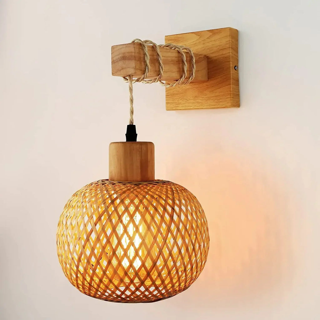 This lamp’s rattan globe shade emits gentle, inviting light—perfect for a warm ambiance.