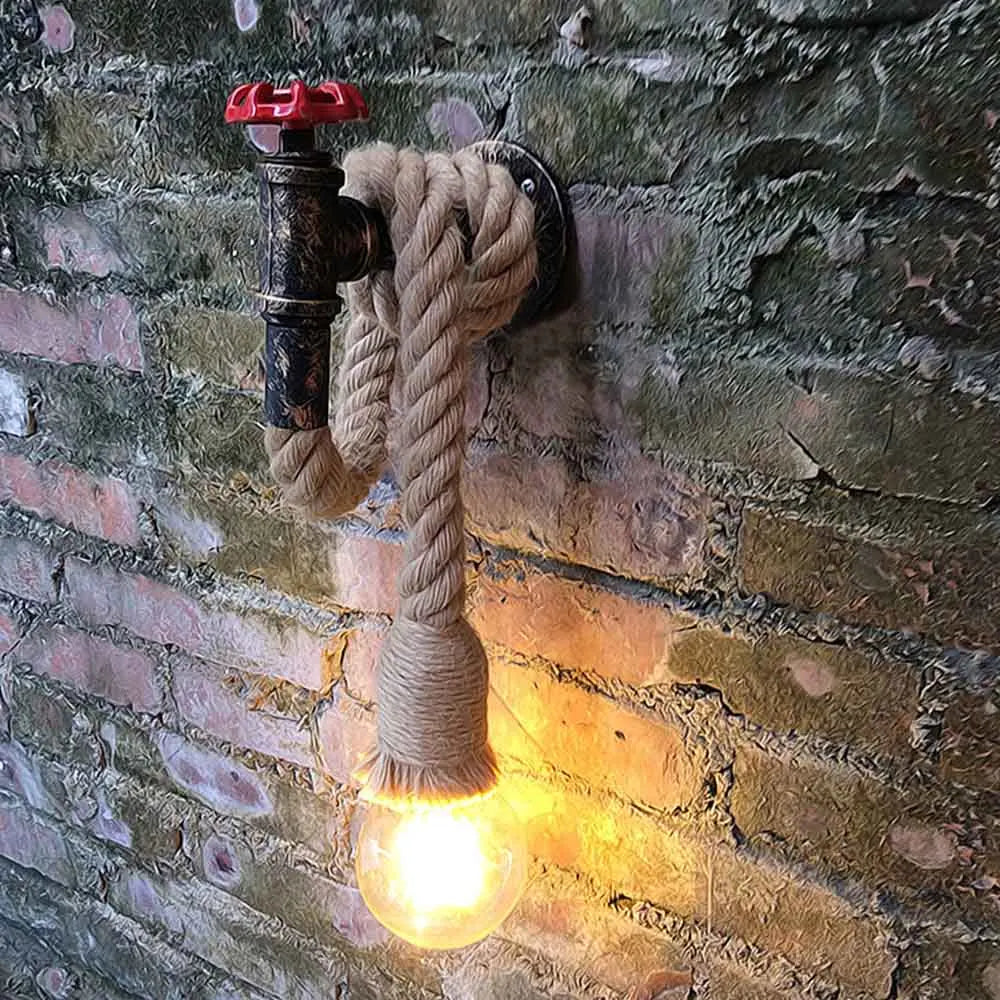 Industrial sconce gives off a warm, glowing light from its distinctive hemp rope bulb design.
