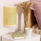 The ORLUNE HOME Japanese Rotin Wall Light casts a warm, inviting glow nearby.